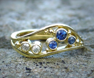 18ct Sapphire and Diamond Wave Dress Ring.
