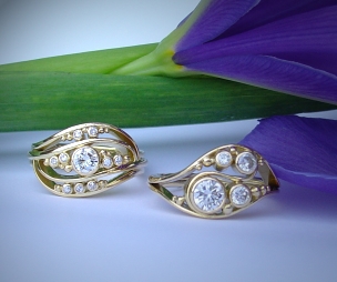 Two 18ct gold dress wave rings with Diamonds.