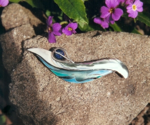 Sterling Silver Enamel brooch with a caged Lapis Stone.